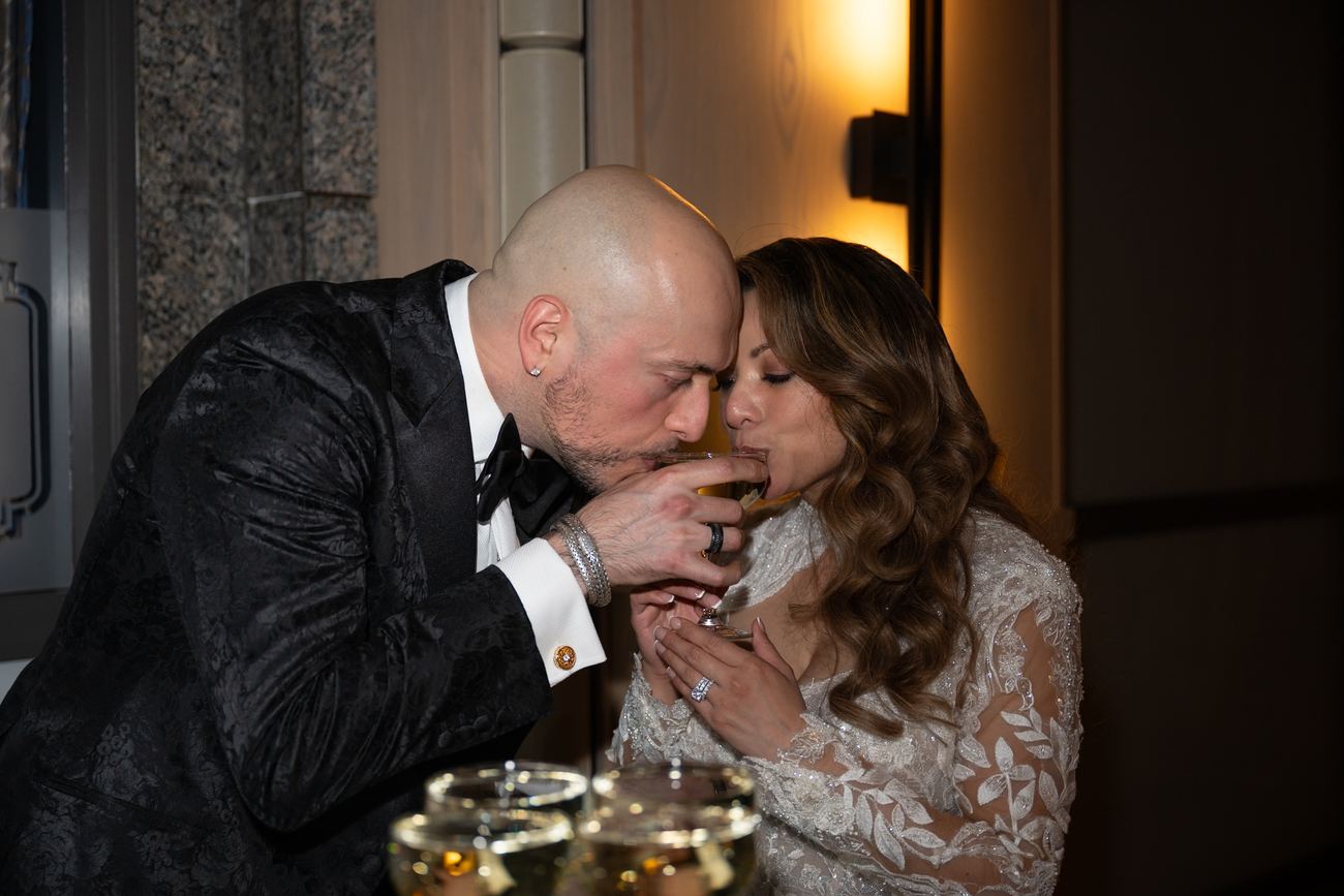 Couple sharing a candlelit cheek-to-cheek embrace
