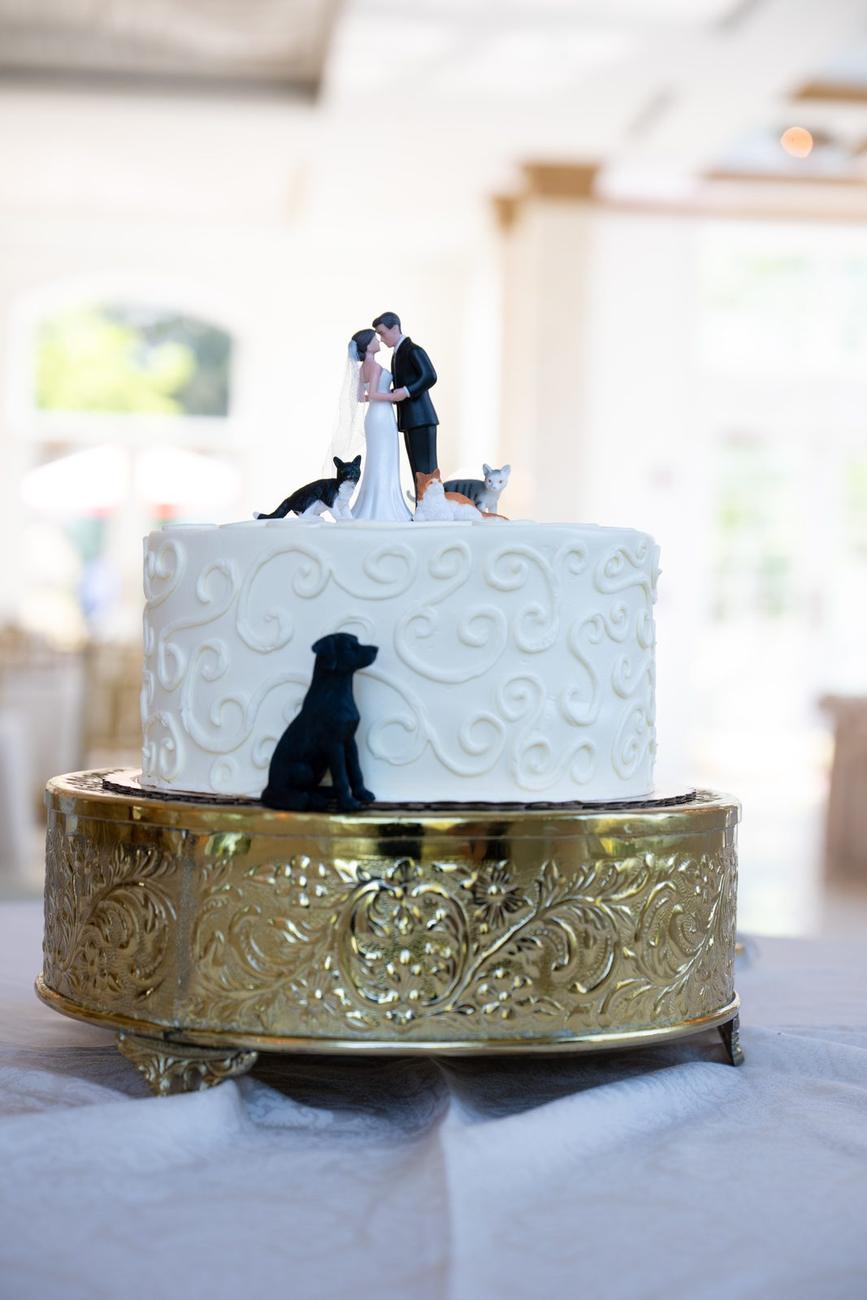 Wedding cake with a small dog-shaped topper