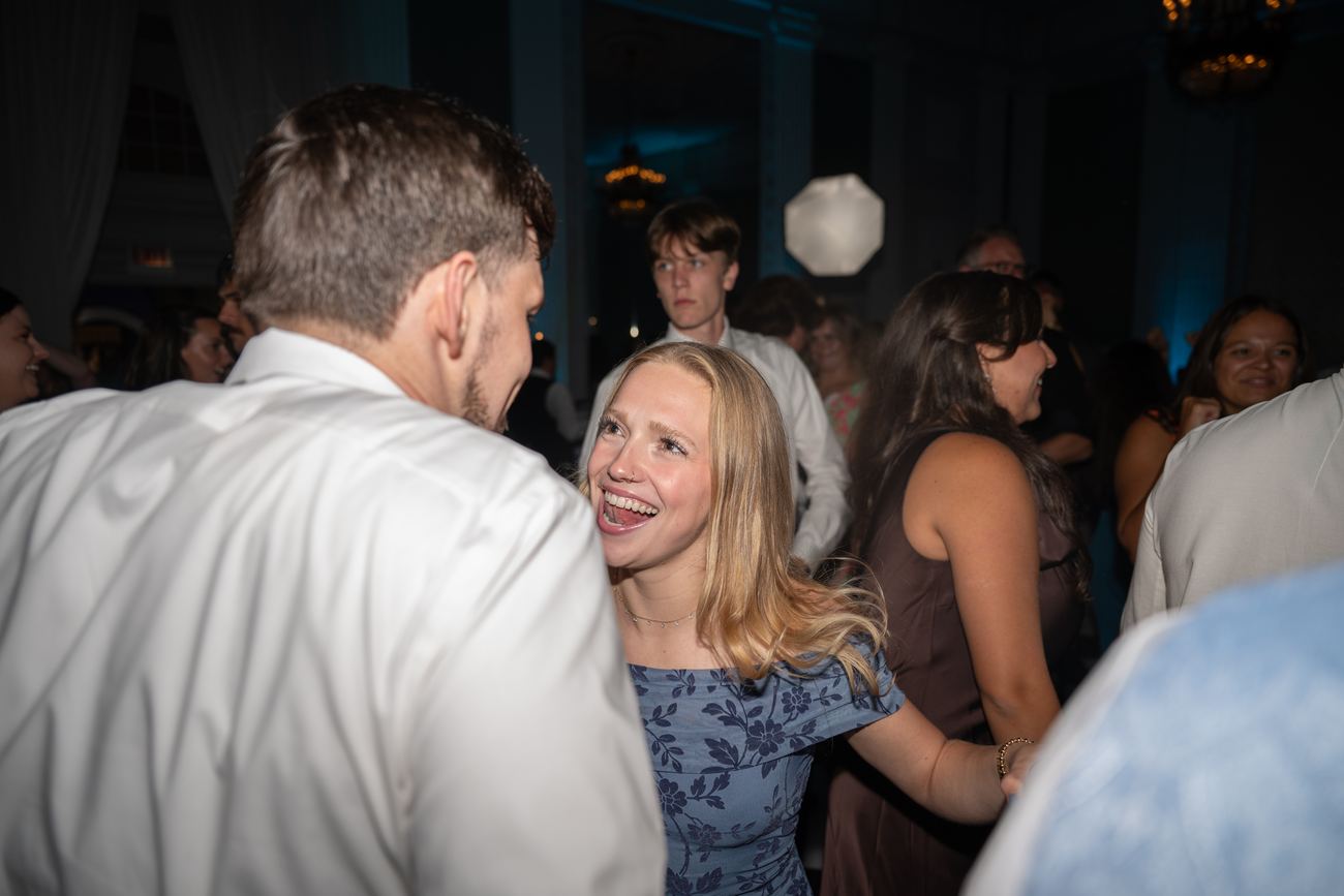 Guests laughing together on the dance floor
