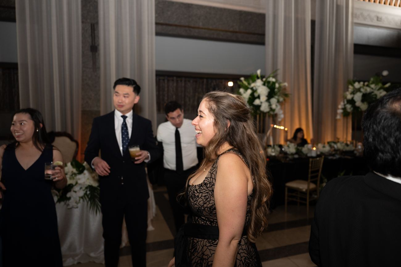 Guests laughing together at the reception