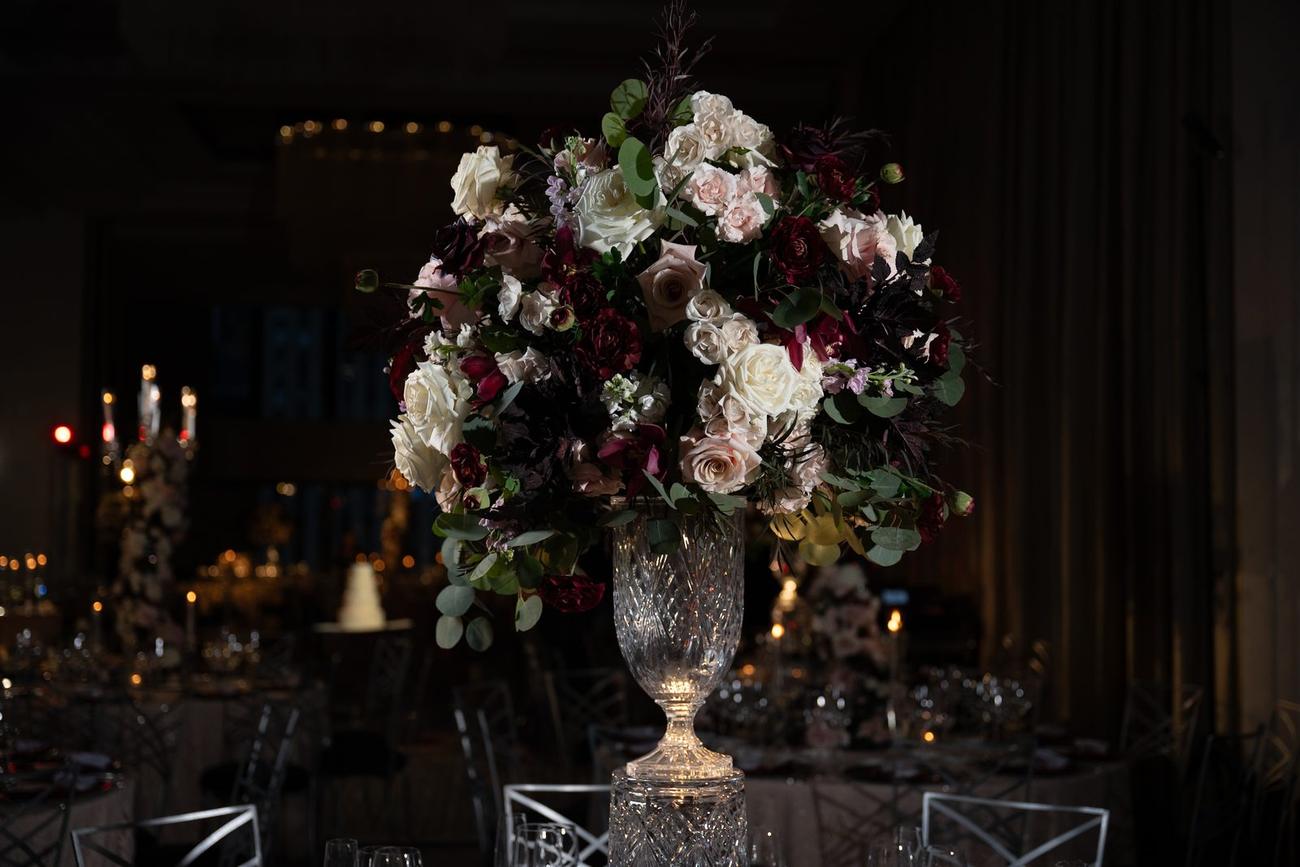 Reception tablescape with a candlelit floral centerpiece
