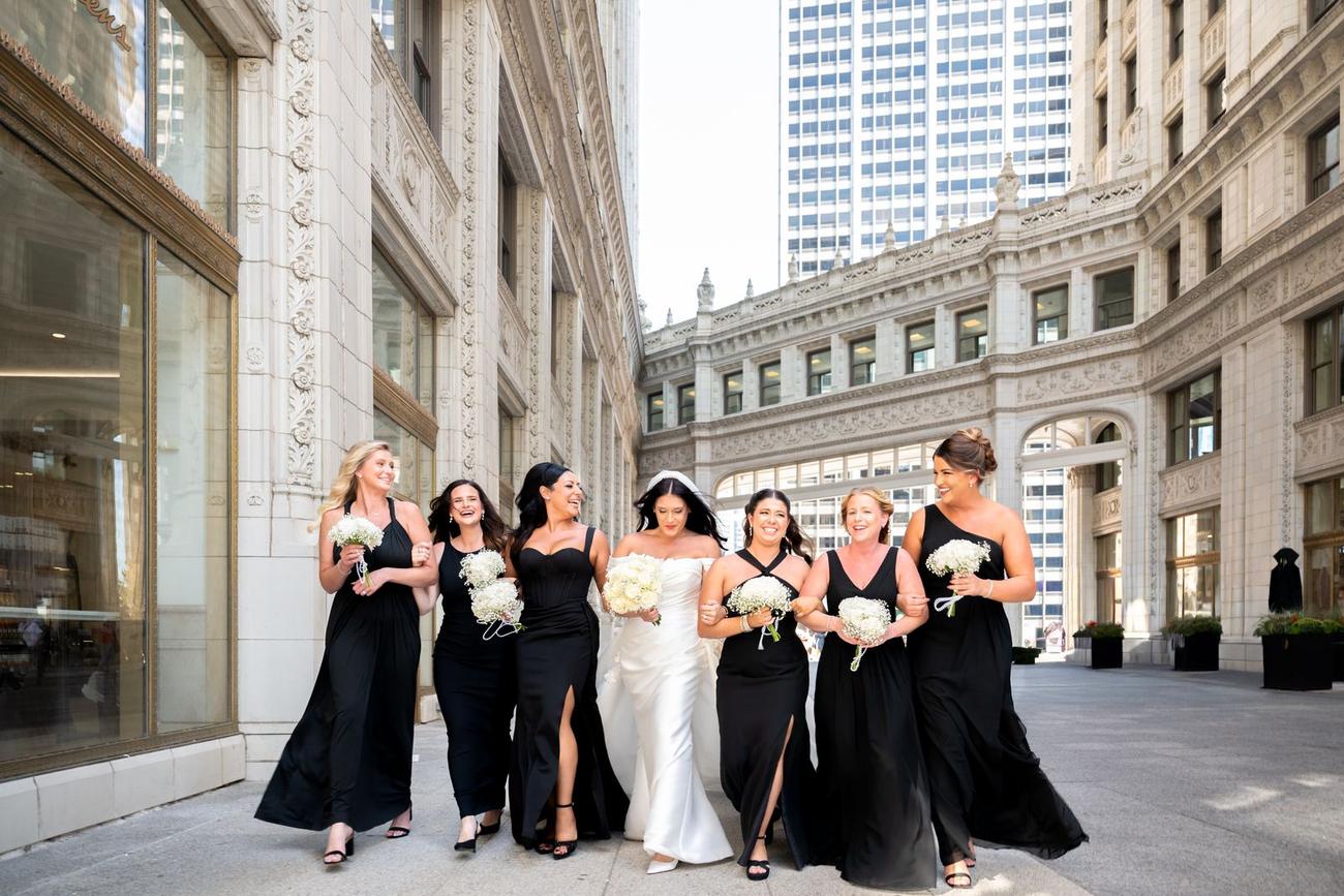 Bridal party walking through downtown Chicago architecture